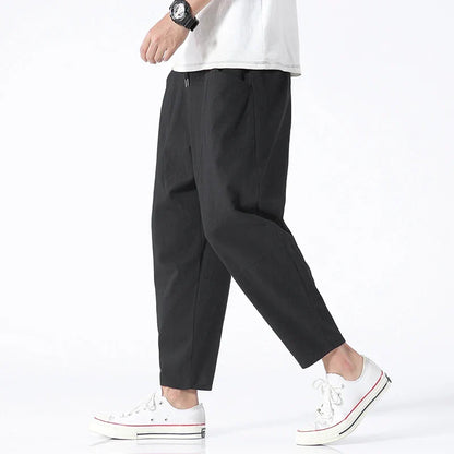 Lightweight men's cropped pants with a comfortable drawstring waist & relaxed tapered fit. Perfect for summer.