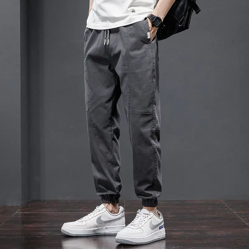Gray men's cotton blend relaxed fit tapered joggers, perfect for athletic activities & loungewear.