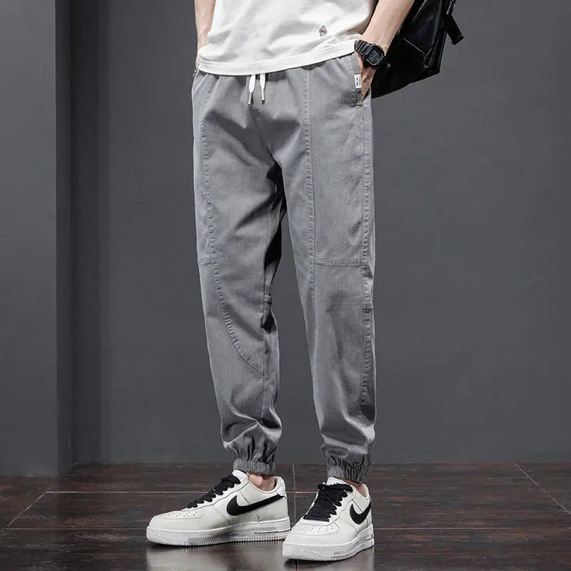 Comfortable men's relaxed fit joggers with tapered leg & adjustable drawstring, ideal cotton blend loungewear.