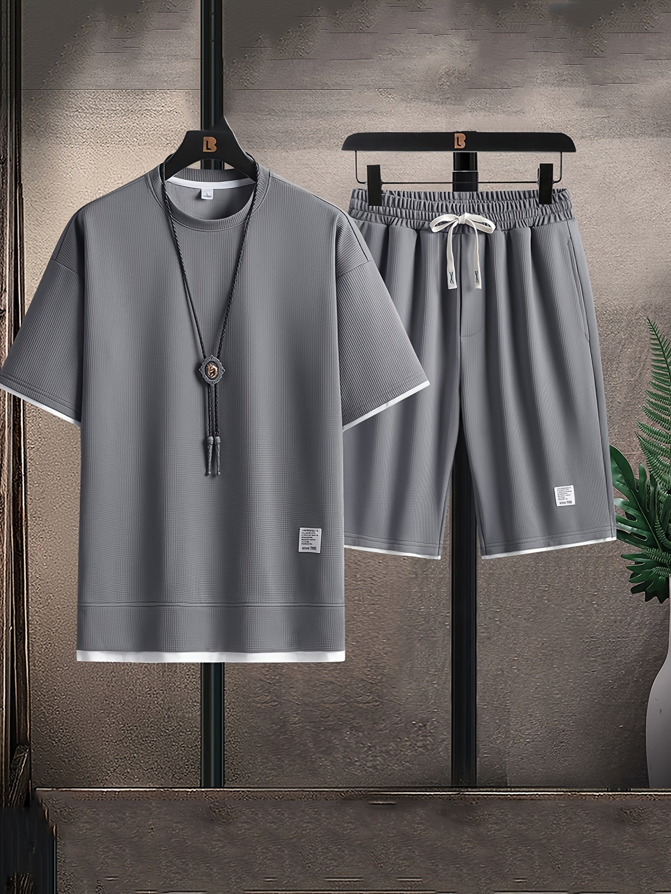 Men's relaxed fit two-piece lounge set with t-shirt & drawstring shorts. Comfortable, casual home wear.