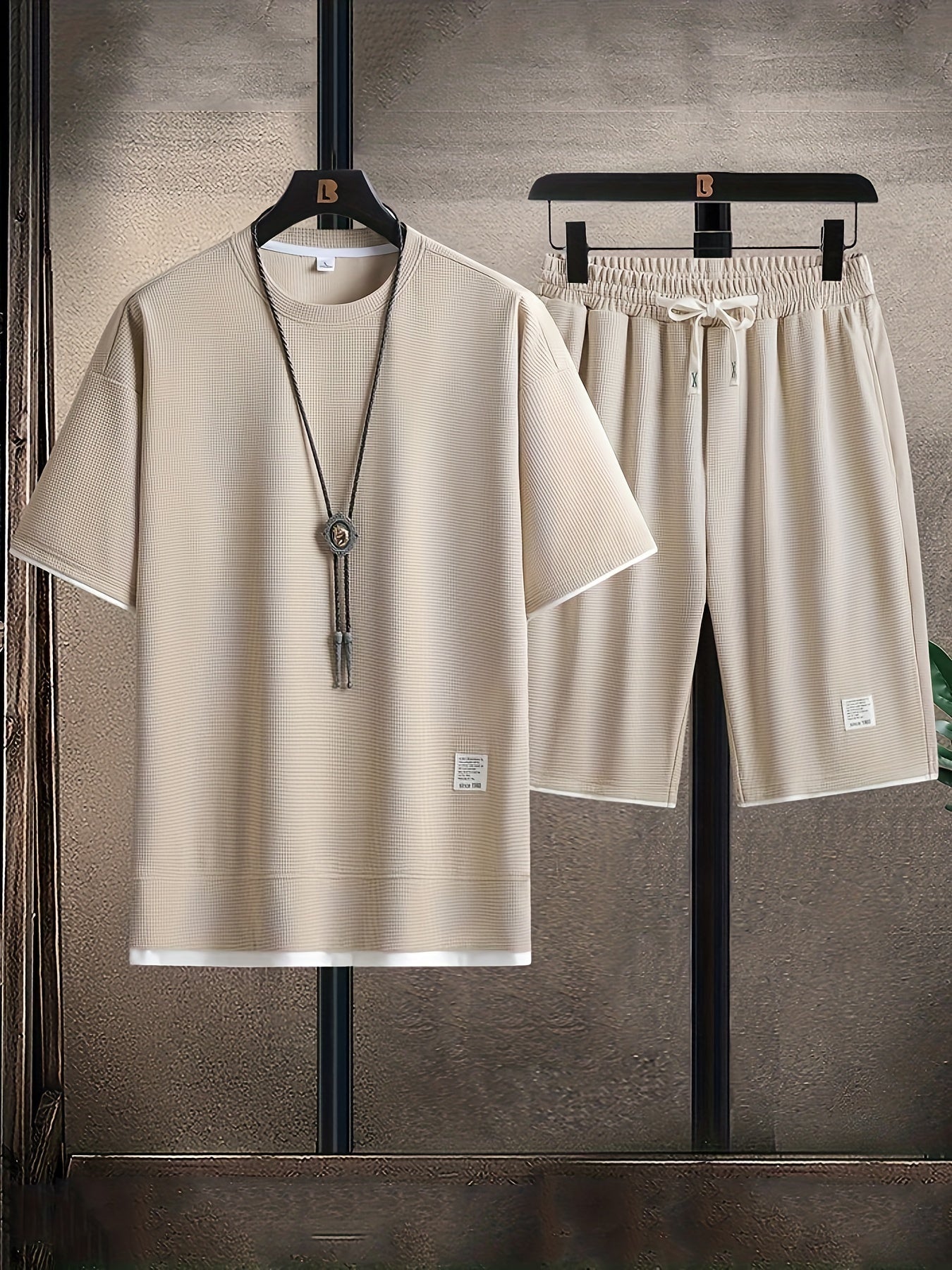 Men's comfortable two-piece lounge set. Relaxed fit t-shirt & drawstring shorts for stylish home wear.