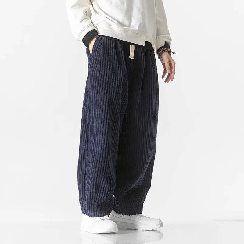 Men's relaxed fit drawstring pants, offering a comfortable wide leg for versatile weekend and lounge style.