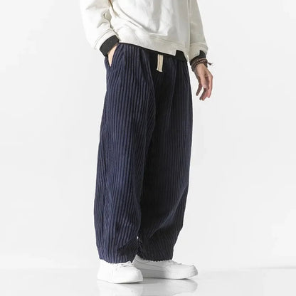 Men's relaxed fit drawstring pants, offering a comfortable wide leg for versatile weekend and lounge style.