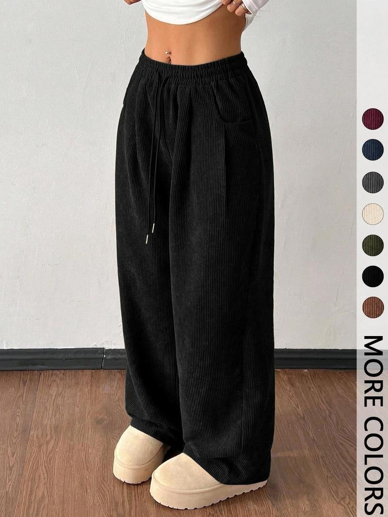 Men's wide-leg trousers with drawstring waist, offering relaxed fit and versatile casual fashion.