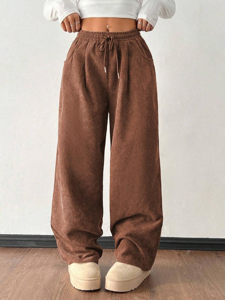 Men's relaxed fit wide-leg trousers, casual comfort pants with drawstring, versatile for men's fashion.