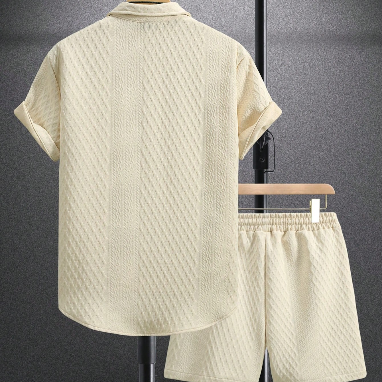 Black men's two-piece casual summer outfit. Features a button-up shirt and comfortable drawstring shorts.