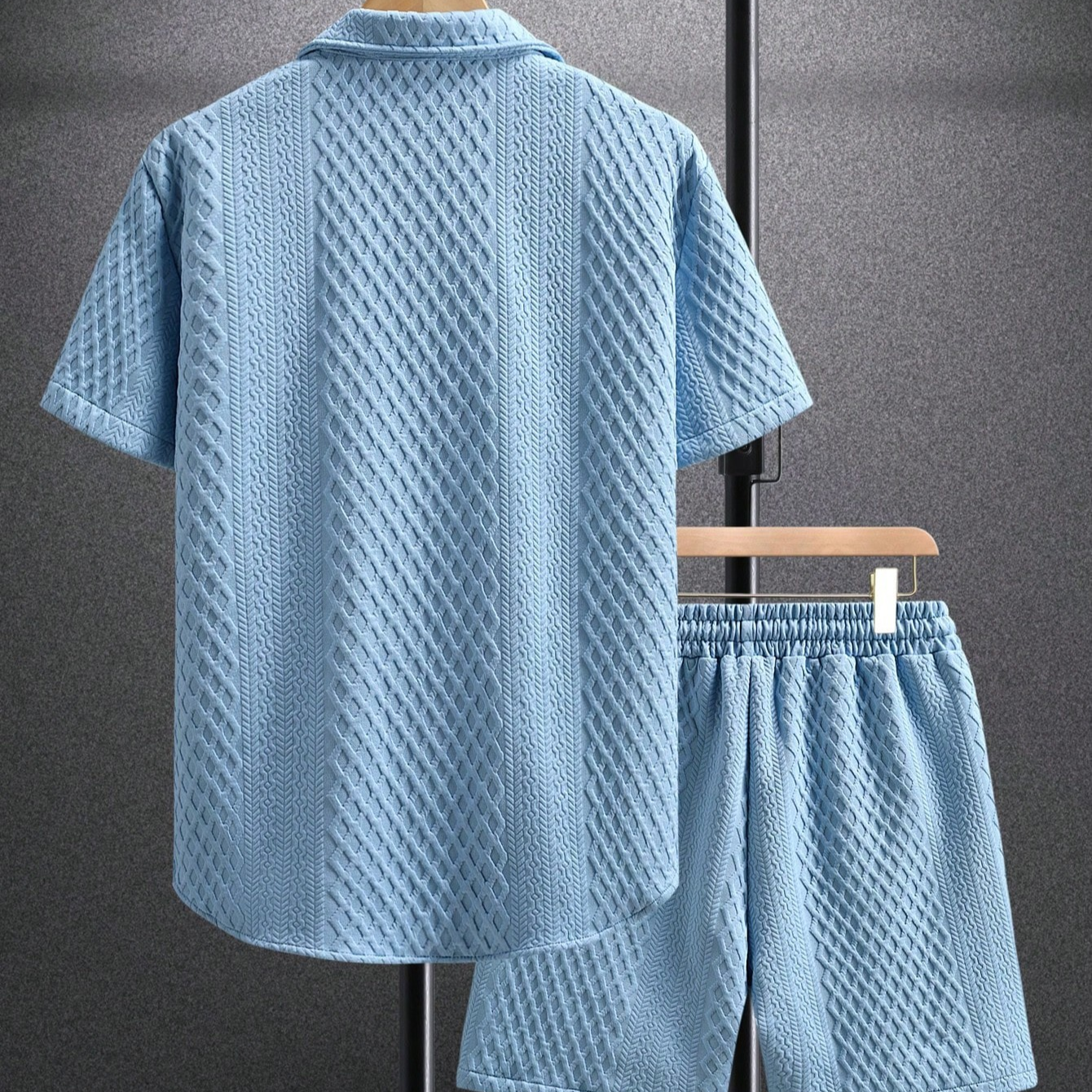 Men's relaxed summer set featuring a button-up shirt and drawstring shorts, perfect for beachwear.