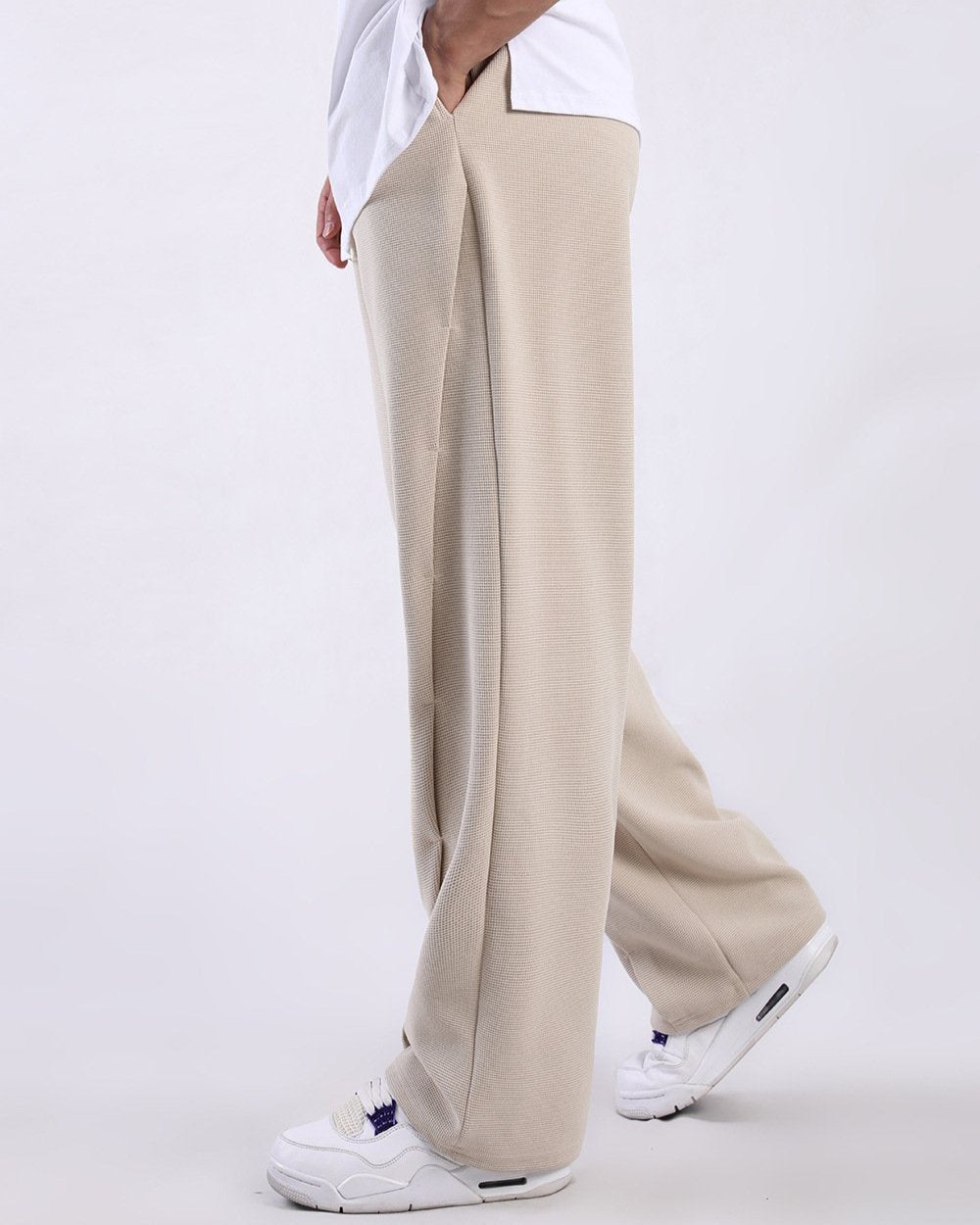 Men's relaxed waffle knit sweatpants with drawstring & elastic waist, perfect for modern comfort & lounge.