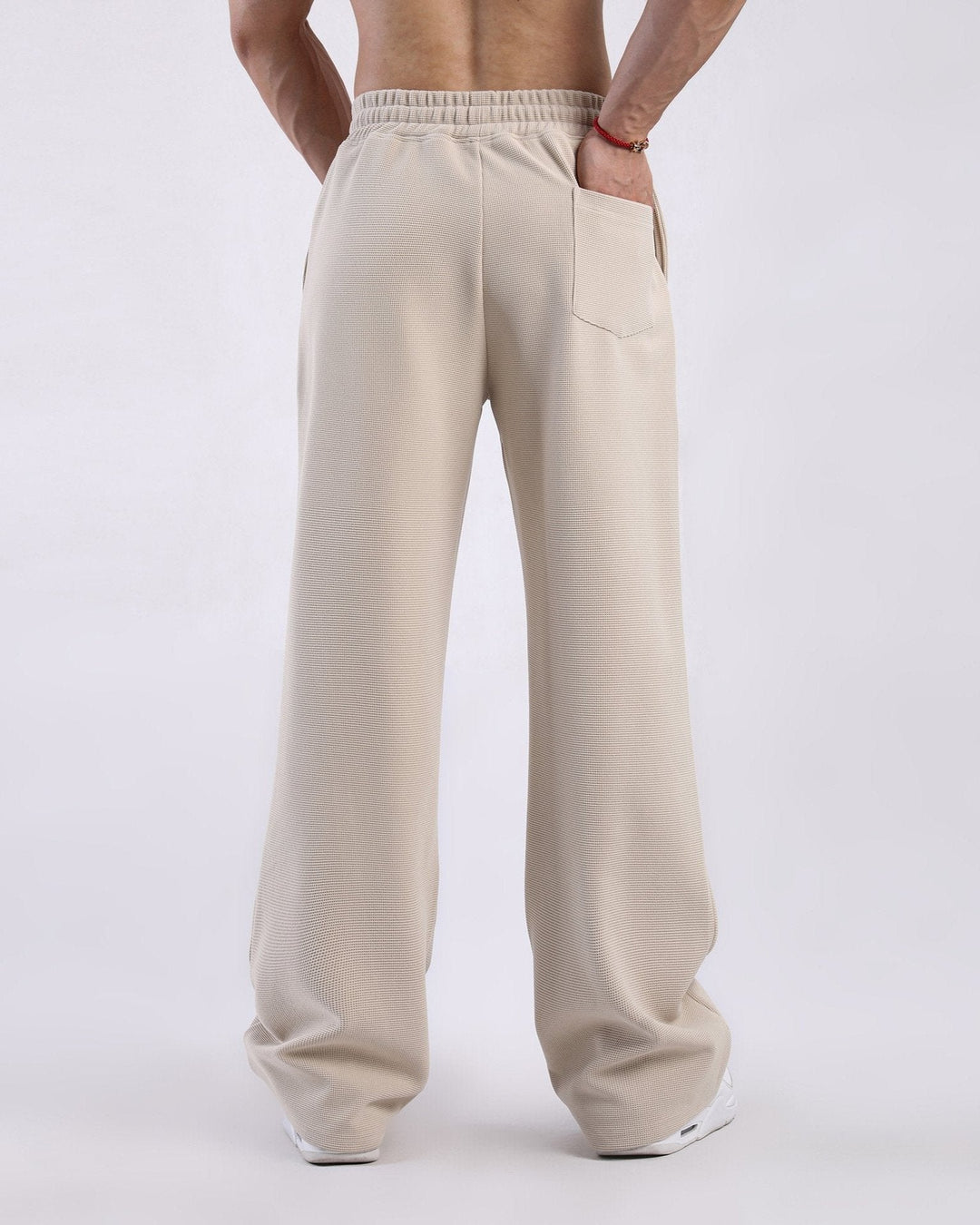 Men's waffle knit straight leg sweatpants, versatile for casual wear, lounging, or athletic activities.