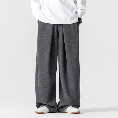 Modern men's wide-leg trousers, relaxed fit and comfortable drawstring, perfect for stylish casual wear.