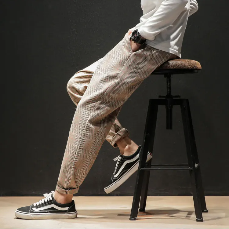 Side profile of Men's Renegade Plaid Trousers, showing the modern tapered leg and overall shape.
