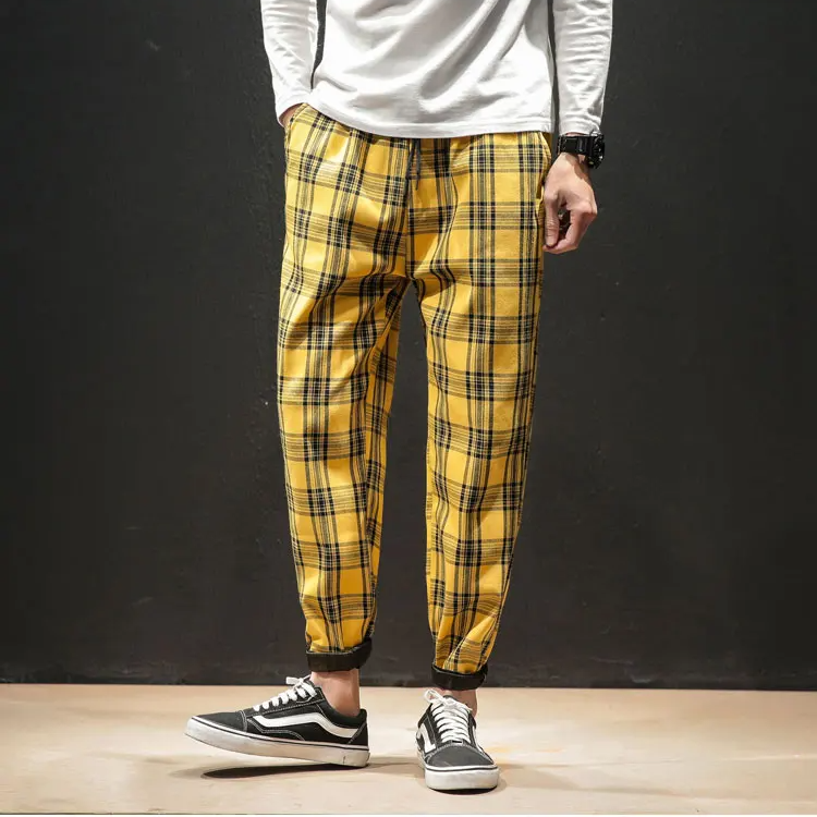 Stylish plaid pattern on Men's Renegade Trousers, perfect for a contemporary men's fashion statement.