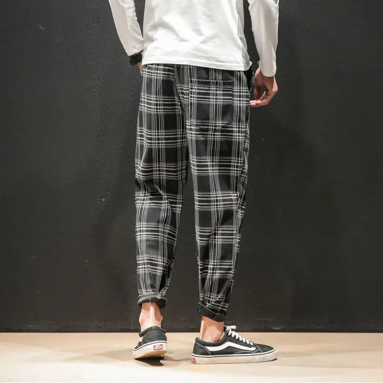 Modern style Men's Plaid Trousers with a sophisticated tapered fit, perfect for contemporary fashion.