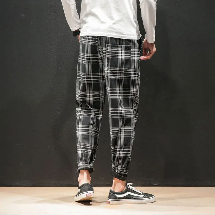 Modern style Men's Plaid Trousers with a sophisticated tapered fit, perfect for contemporary fashion.
