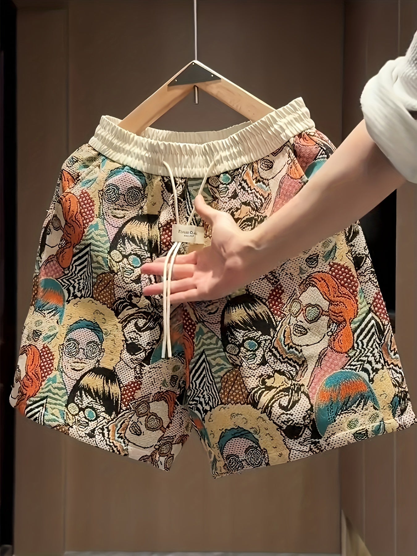 Bold men's pop art graphic print shorts, retro design with a comfortable drawstring for unique summer casual wear.