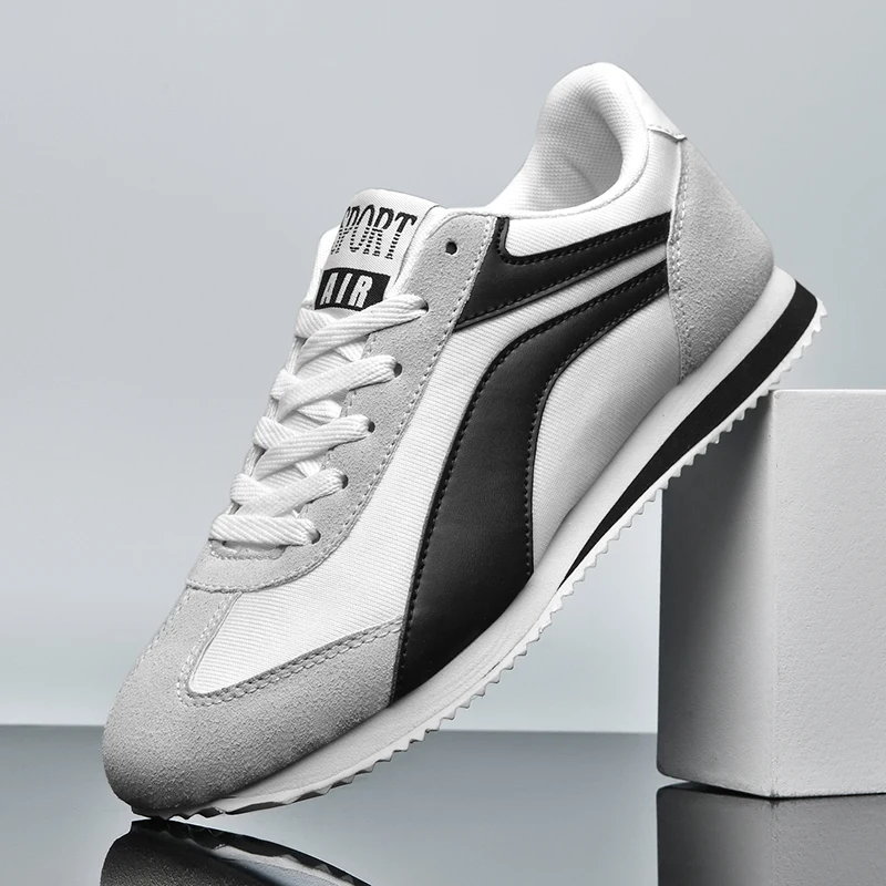 All-day comfort men's retro black sneakers, timeless casual footwear.