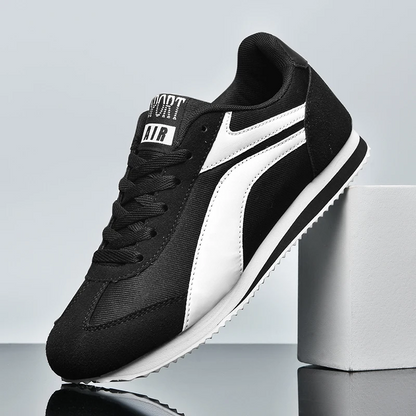 Lightweight men's retro white and black sneakers, stylish & comfortable.