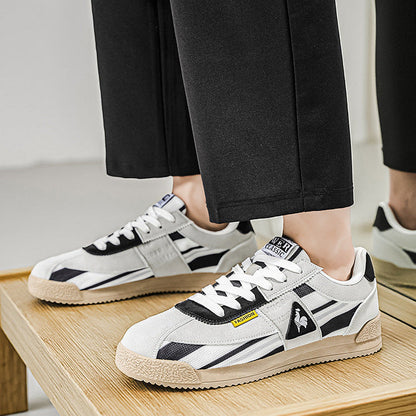 Urban men's retro track sneakers, vibrant 80s style, grooved sole for comfortable street fashion.