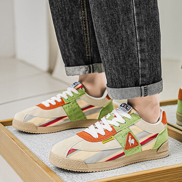 Dynamic men's low-cut track sneakers in colorful retro 80s style, perfect for urban wear.