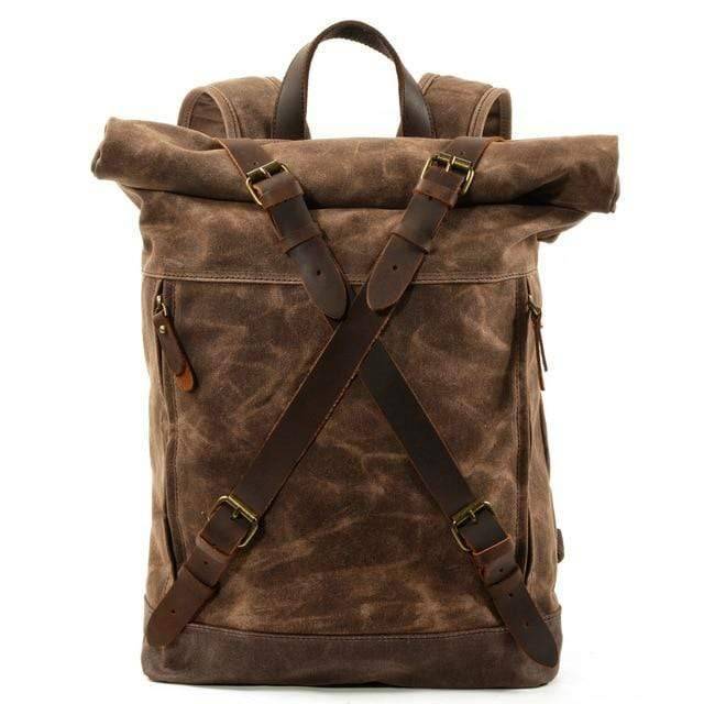 Waterproof cowhide outdoor survival backpack for men, against a natural background