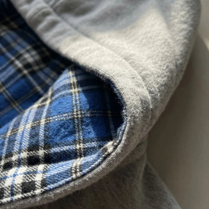 Close-up of the comfortable hood and durable zipper on the Josh men's reversible oversized hoodie for comfort.