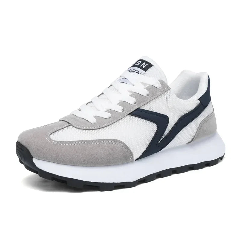 Side view of men's Revive running trainers, showcasing stylish design, cushioned sole & breathable material.
