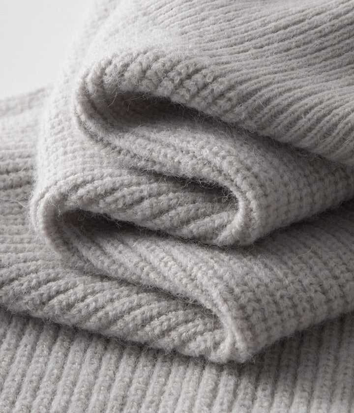 Detail-rich ribbed men's zip cardigan with funnel neck, excellent for fashionable layering.