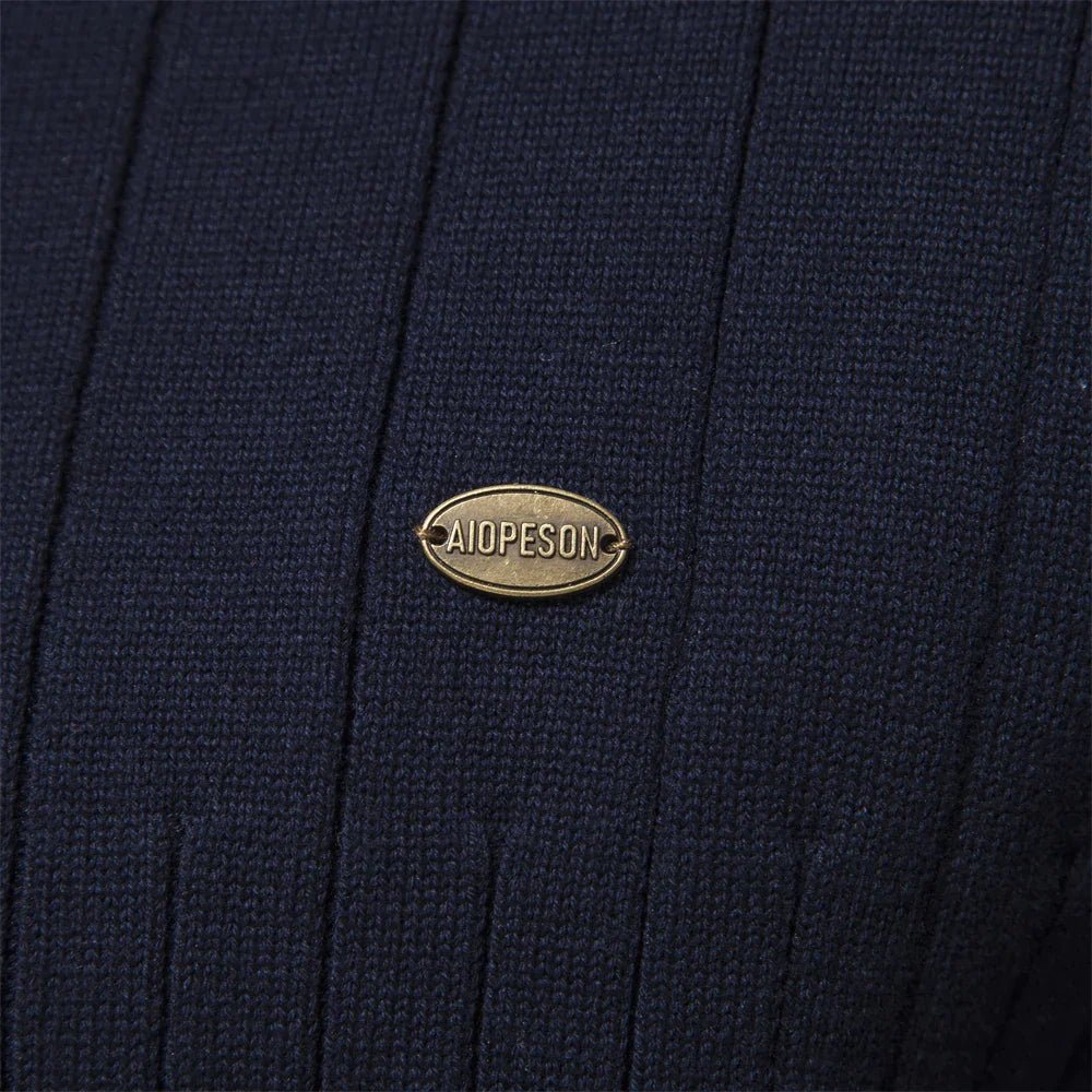 Close-up of a men's ribbed half-zip sweater fabric, showcasing the detailed texture for cold weather.