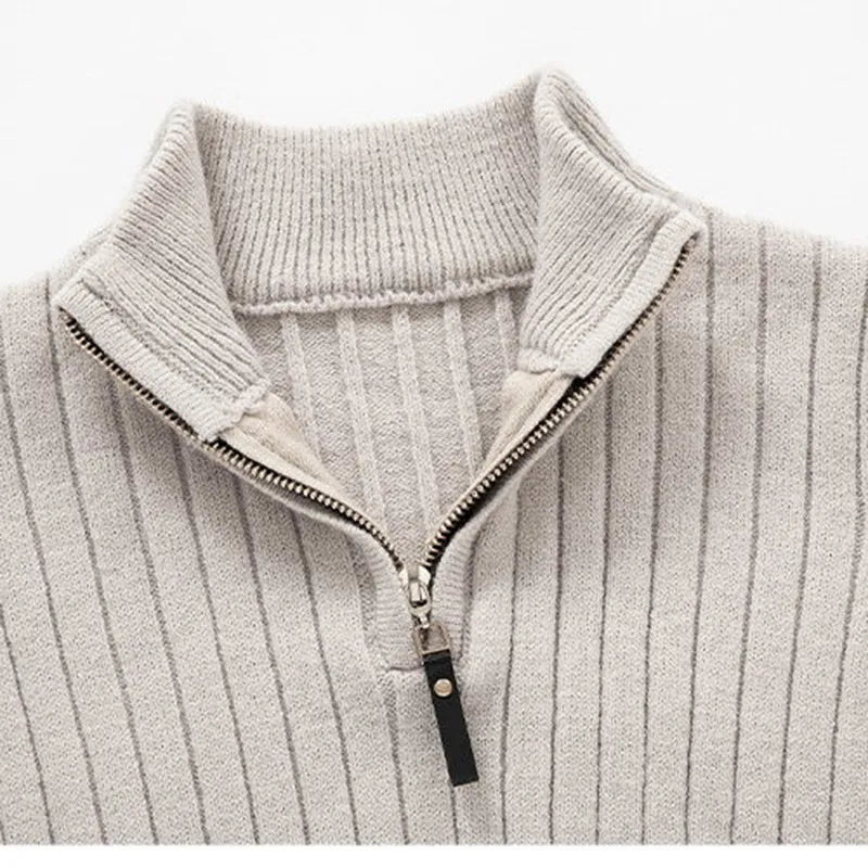 Close-up of men's ribbed half-zip sweater. Highlights sophisticated knit texture & quality menswear.