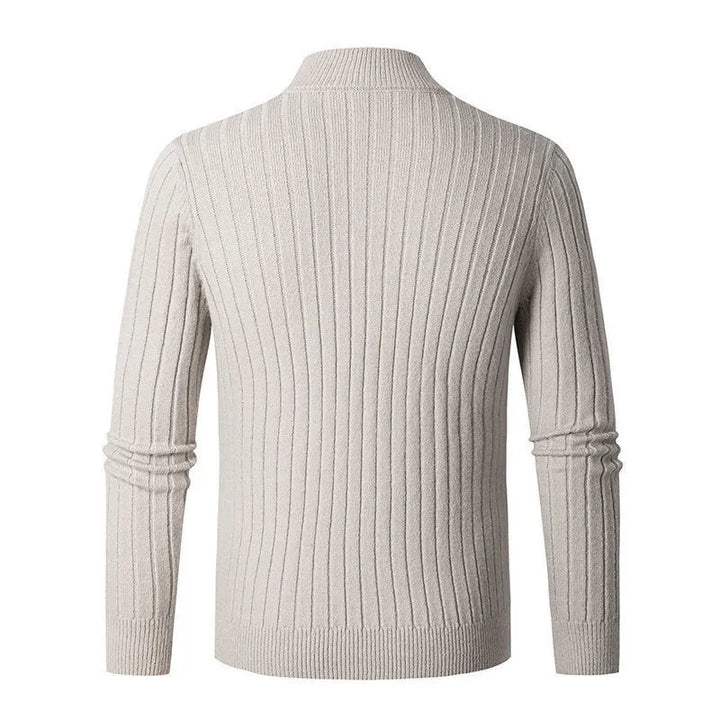 Stylish man wearing a ribbed half-zip sweater, perfect for casual comfort or sophisticated layering.