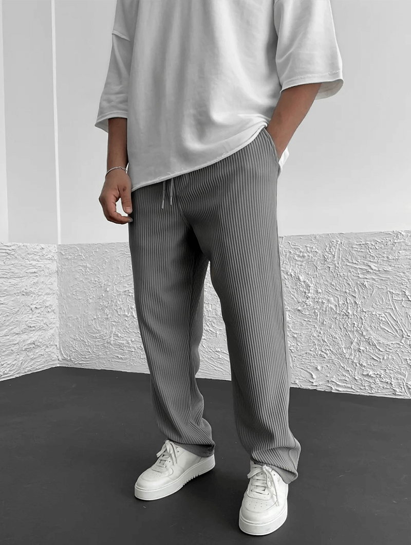 Stylish men's ribbed pants with a relaxed jogger fit, perfect for modern activewear.