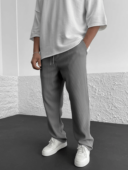 Stylish men's ribbed pants with a relaxed jogger fit, perfect for modern activewear.
