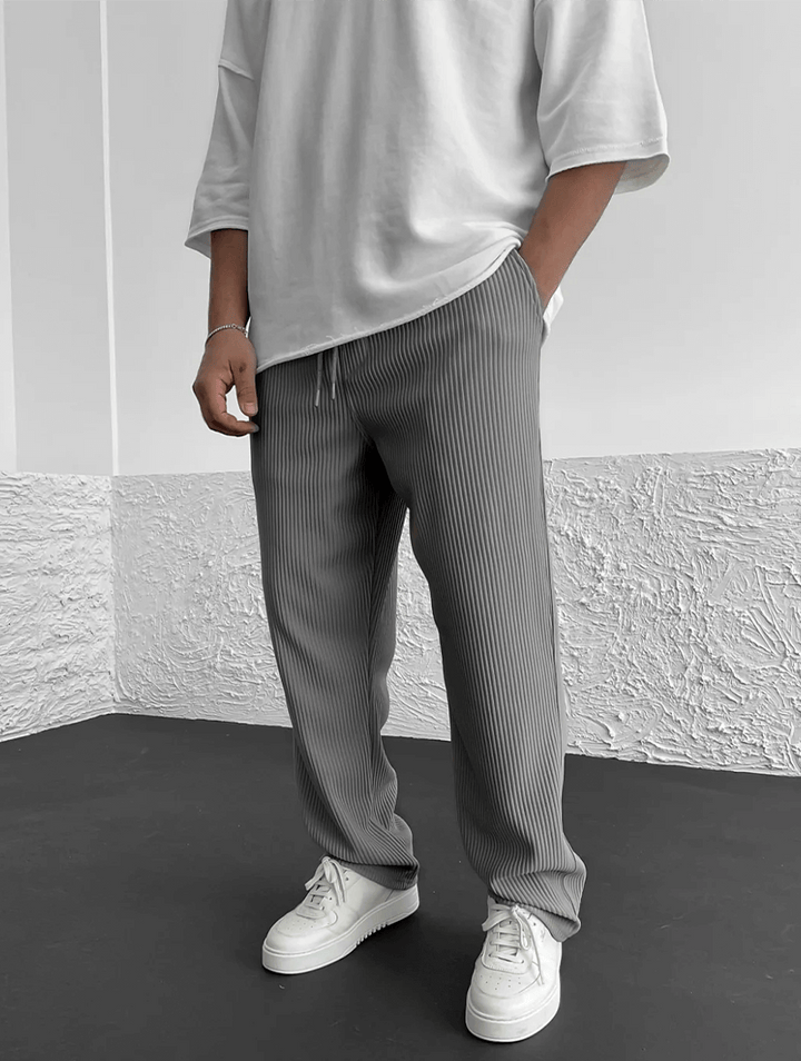 Stylish men's ribbed pants with a relaxed jogger fit, perfect for modern activewear.