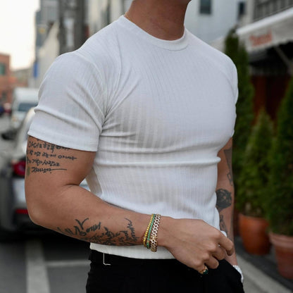 Men's ribbed performance t-shirt with dynamic fit. Slim, comfortable athletic top for everyday wear.