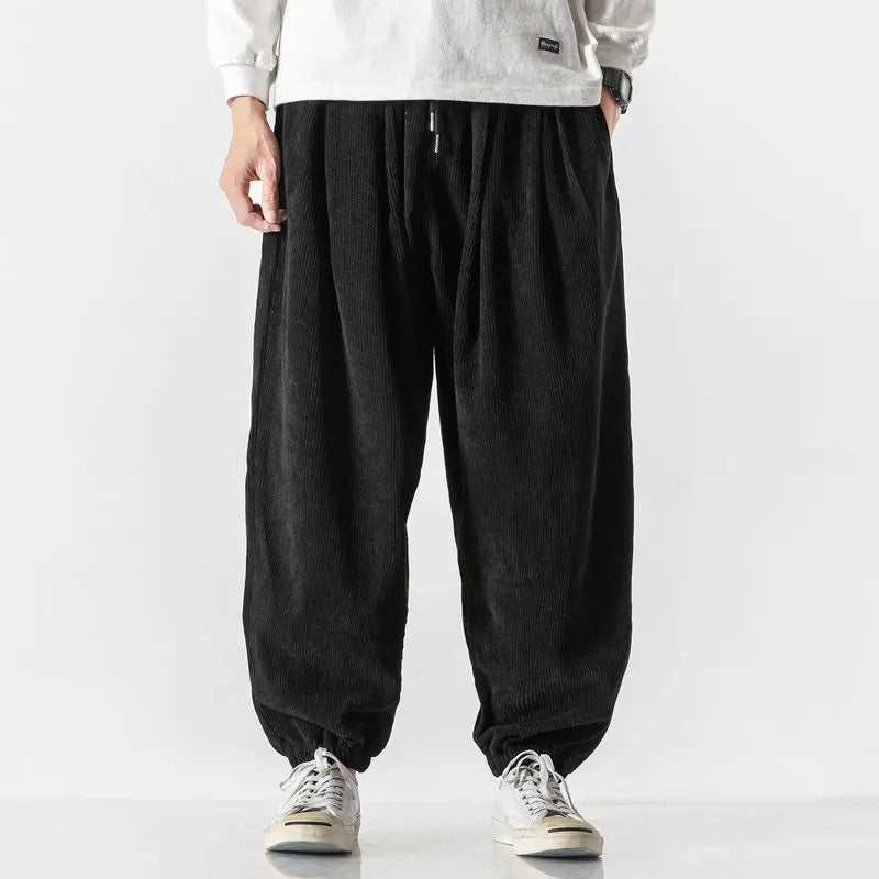 Casual men's wide leg corduroy pants with a comfortable relaxed fit and elastic waist design.