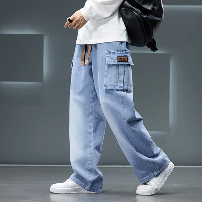 Relaxed fit men's Rogue Cargo Pants with vintage wash & wide leg, offering comfortable streetwear style.