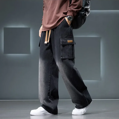Close-up of men's Rogue Cargo Pants showcasing relaxed fit, wide leg, drawstring waist & vintage wash detail.
