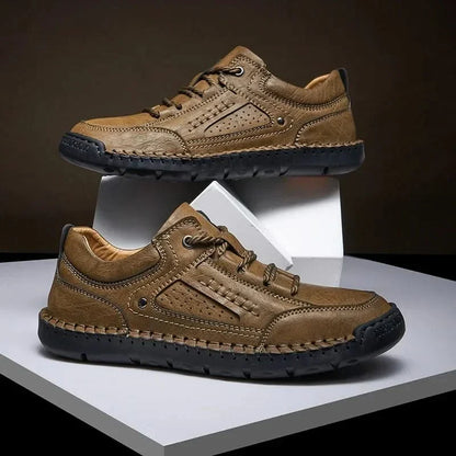 Front view of khaki men's all-terrain hiking shoes, with protective toe cap for rugged trails.