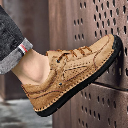 Close-up of rugged all-terrain sole on men's hiking shoes, perfect for trail grip and durable trekking.
