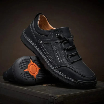 Black men's rugged walking shoes, designed for comfortable trekking and all-terrain outdoor adventures.