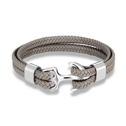 Men's nautical style leather bracelet with a striking stainless steel anchor, masculine wrist accessory.