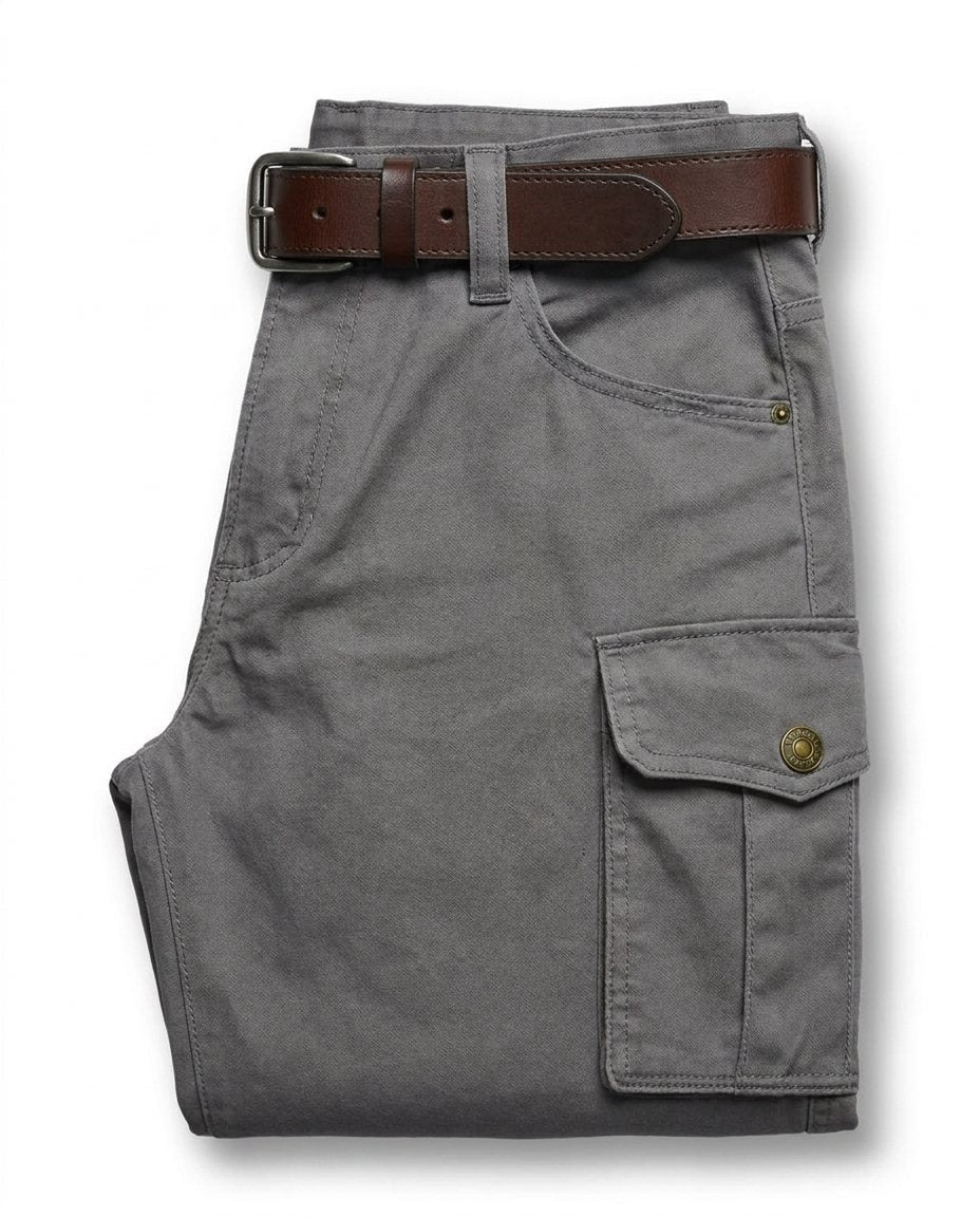 Men's rugged leather cargo pants on a model, demonstrating comfortable fit & utility for active wear.