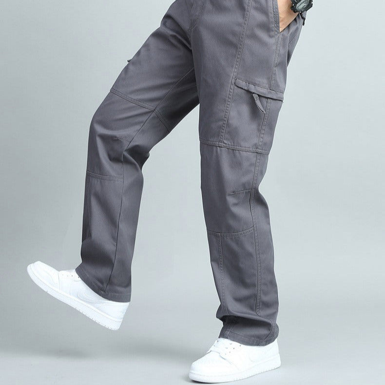 Olive green rugged men's cargo pants, multi-pocket design for outdoor utility and comfort.
