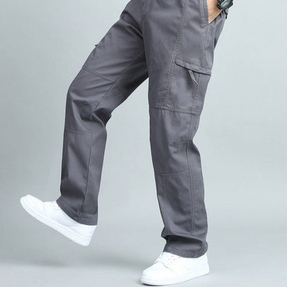 Olive green rugged men's cargo pants, multi-pocket design for outdoor utility and comfort.