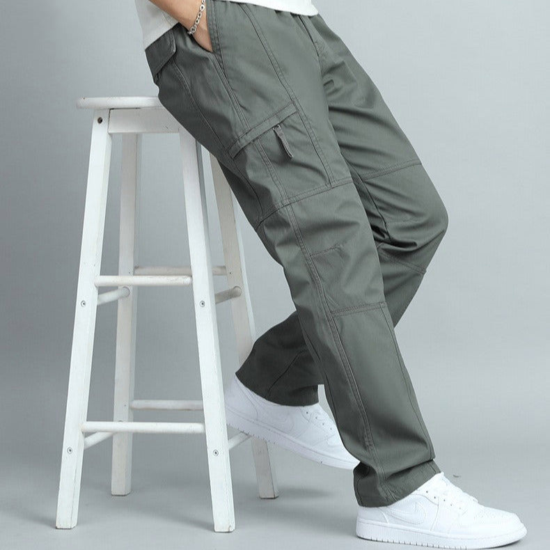 High-quality zipper and button closure on men's rugged utility cargo pants, secure and durable.