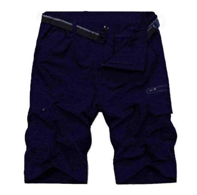 Athletic man wearing quick dry tactical shorts, suitable for hiking, camping, and adventure sports.