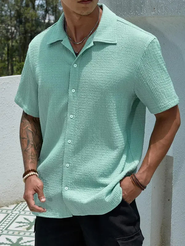 Stylish men's button-up short sleeve shirt with a subtle texture, great for summer and versatile looks.