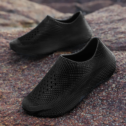 Rugged sole of men's all-terrain running shoes, providing grip for trails, outdoor adventure & athletic running.