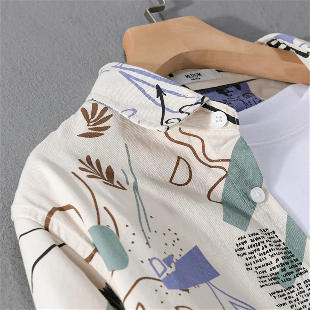Artistic men's shirt displaying a dynamic abstract graffiti print, offering a fresh, unique look for summer fashion.
