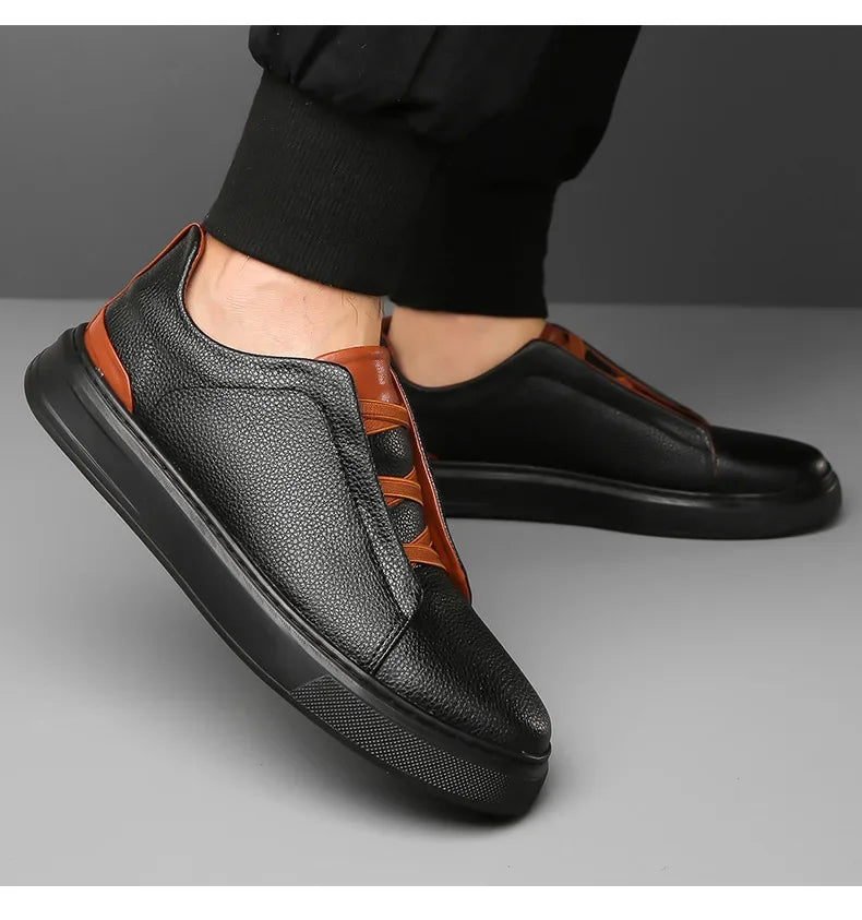 Front view of men's modern sneakers, showcasing effortless style & comfort for street fashion.